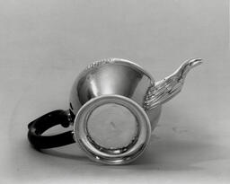Teapot held by J. Herbert Gebelein