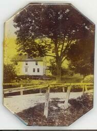 Glass encased photograph of John Greenleaf Whittier's birthplace.